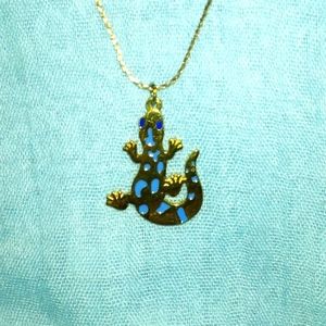 3-8-46 lizard goldtone with blue spots on long goldtone chain great condition